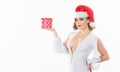 Girl Wear Santa Claus Hat. Gift From Santa. Woman Attractive Lady Wear Sexy Dress And Santa Hat. Girl Hold Cute Box