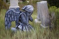 Girl wearing an angel costume in an old grave yard Royalty Free Stock Photo