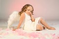 Girl wearing angel wings Royalty Free Stock Photo