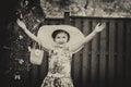 Girl Wearing a Big Sun Hat with Hands Up - Vintage