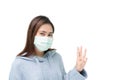 Girl wearing mask againt flu and covid-19,corona virus, put up three fingers Royalty Free Stock Photo