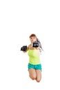 girl wearing boxing gloves ready to fight and punching or hitting camera or you while jumps Royalty Free Stock Photo