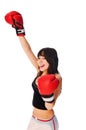 Girl wearing boxing gloves with a rised hand