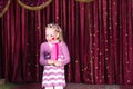 Girl Wearing Clown Make Up Holding Large Comb Royalty Free Stock Photo