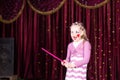 Girl Wearing Clown Make Up Holding Large Pink Comb Royalty Free Stock Photo