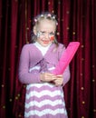 Girl Wearing Clown Make Up Holding Over Sized Comb Royalty Free Stock Photo