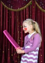 Girl Wearing Clown Make Up Holding Over Sized Comb Royalty Free Stock Photo