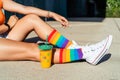 Girl wearing colorful rainbow pride socks