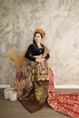 Girl wearing Endek woven cloth and Balinese Kebaya Royalty Free Stock Photo