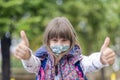 Girl wearing face mask during corona virus and flu outbreak.