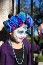 SAN ANTONIO, TEXAS - OCTOBER 28, 2017 - Girl wearing face paint and floral headdress for Dia de Los Muertos/Day of the Dead