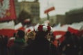 Girl wearing a flower crown in the colors of Polish flag marching on the Independence day of Poland