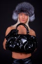 Girl wearing fur hat and holding a bag Royalty Free Stock Photo