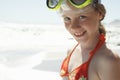 Girl Wearing Goggles Looking Away At Beach