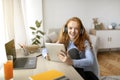 Girl wearing headphones enjoying music using tablet Royalty Free Stock Photo