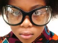 Girl wearing huge bugeye glasses Royalty Free Stock Photo