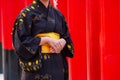 Girl Wearing Japan Culture Kimono Fushimi. Standing in the Religous Temple Walk path Royalty Free Stock Photo