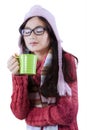 Girl wearing knitted clothes and drinking coffee Royalty Free Stock Photo
