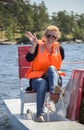 A girl wearing a life jacket while on a boat trip.