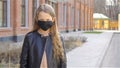 Girl wearing a mask protect against Coronavirus and gripe