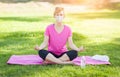 Calm Girl Wearing Medical Face Mask During Yoga Meditation Workout Outdoors