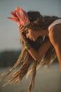 Girl wearing native indian headdress