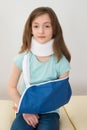 Girl Wearing Neck Brace And Arm Sling
