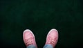 Girl Wearing Pink Canvas Shoes on Chalkboard With Copy Space