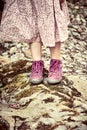 Girl wearing a pink dress and matching boots