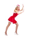 Girl wearing santa claus clothes pushing something