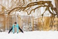 Winter workout. Girl wearing sportswear, stretching exercises. Royalty Free Stock Photo