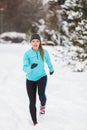 Running girl wearing sportswear, winter fitness Royalty Free Stock Photo