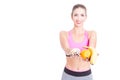 Girl wearing sportswear showing fruits and pills Royalty Free Stock Photo