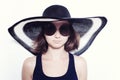 Girl wearing a summer hat and sunglasses Royalty Free Stock Photo