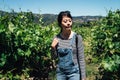 Girl wearing sunglasses standing in grapevine Royalty Free Stock Photo