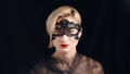 Girl Wearing A Venetian Masquerade Mask And Red Lipstick Over Black Background