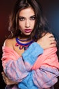Girl is wearing warm colorful sweater and jewelry Royalty Free Stock Photo
