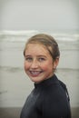 Girl wearing wet suit on Rockaway beach Oregon Royalty Free Stock Photo