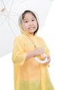 Girl is wearing yellow raincoat and smile Royalty Free Stock Photo