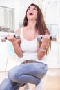 Girl with weights training hard at home Royalty Free Stock Photo