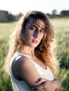 Girl in wheat field, backlight Royalty Free Stock Photo