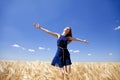 Girl at wheat field in summer day. Royalty Free Stock Photo