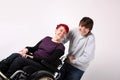 Girl in wheelchair with Helper Royalty Free Stock Photo