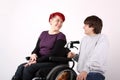 Girl in wheelchair talking with Helper Royalty Free Stock Photo