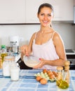 Girl whisking eggs for omelette Royalty Free Stock Photo