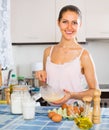 Girl whisking eggs for omelette Royalty Free Stock Photo