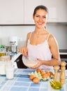 Girl whisking eggs for omelette Royalty Free Stock Photo