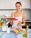 Girl whisking eggs for omelette Royalty Free Stock Photo