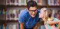 Composite image of girl whispering in male teacher ear Royalty Free Stock Photo