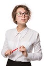 Girl in a white blouse stands on a white background, gestures, emotions on her face